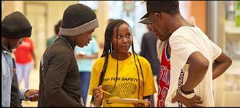 A Step for Safety ambassador speaking with attendees
